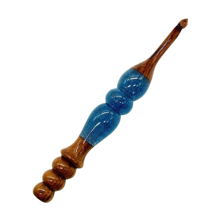A wooden and resin crochet hooks.