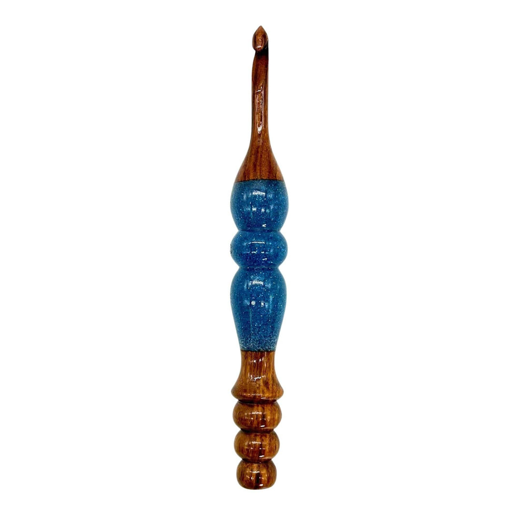 A wooden and resin crochet hooks.