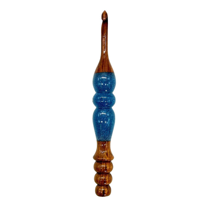 A wooden and resin crochet hooks.