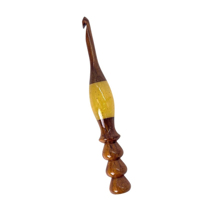 A wooden and resin crochet hooks.