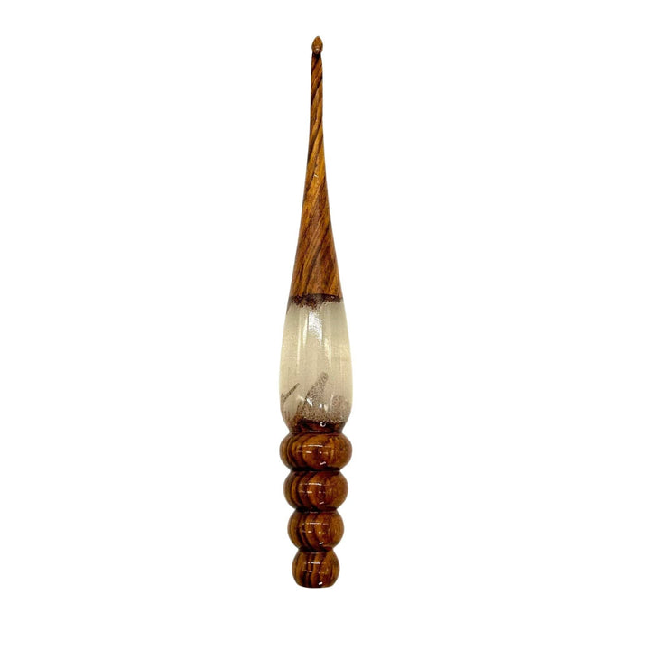A wooden and resin crochet hooks.