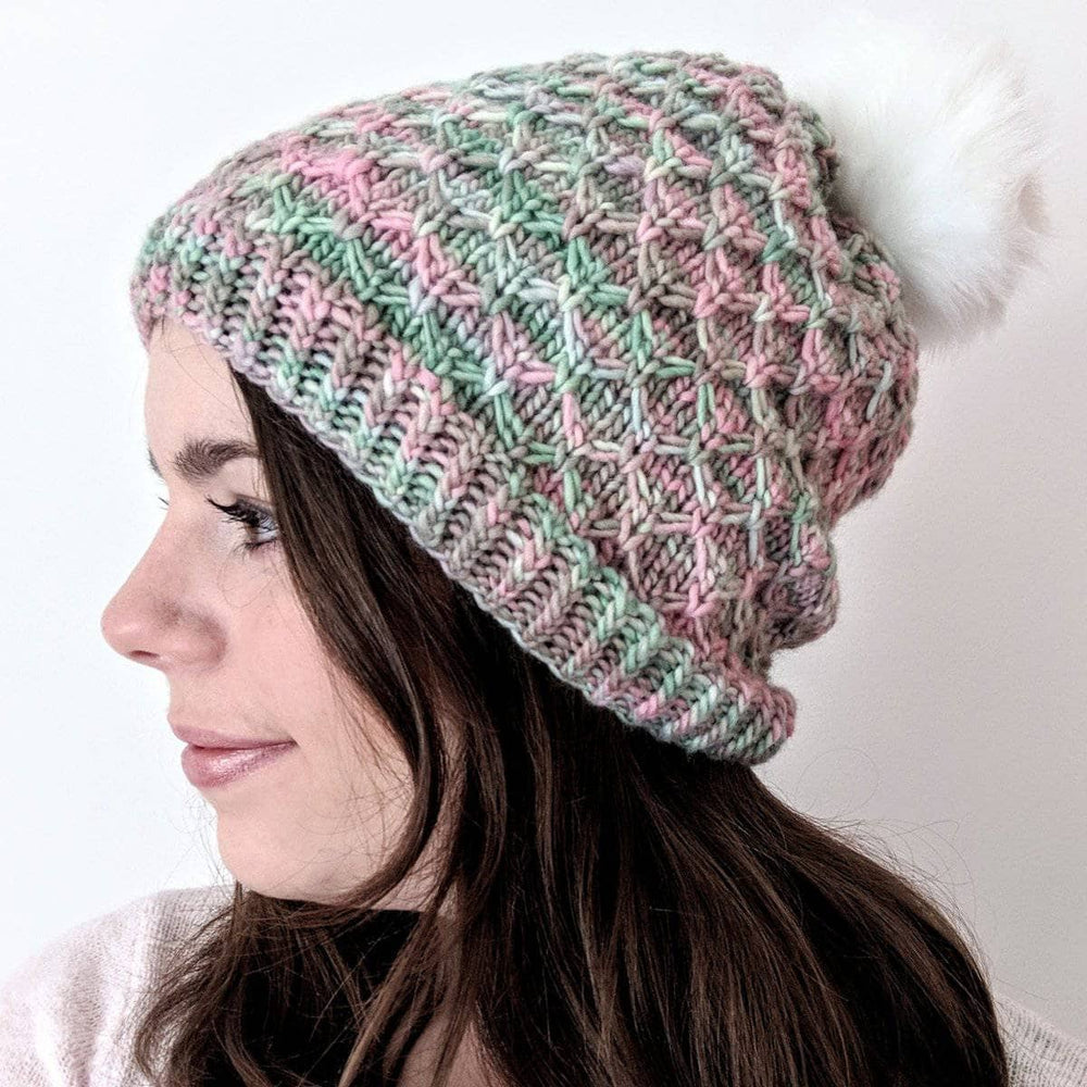 Woman wearing the Storyteller Hat against a white background