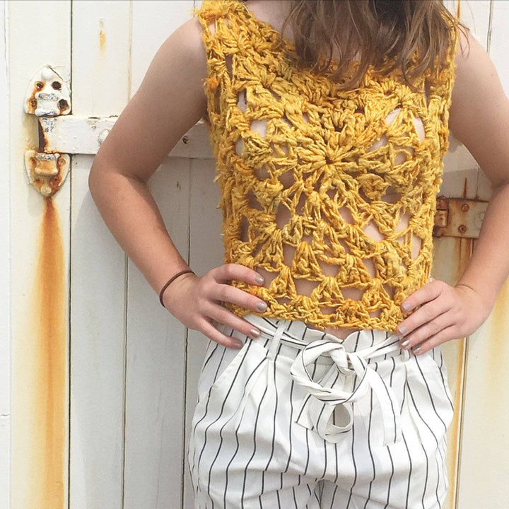 Woman wearing the Sunny Days Tank Top in Sunflower (yellow) against a white background