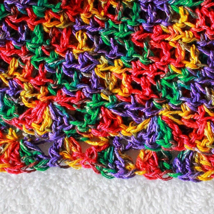 Close up of The Sundaze Crochet Top on a white background
