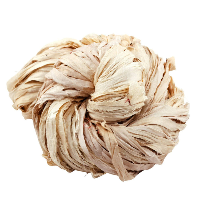 off white ribbon yarn in front of a white background. 