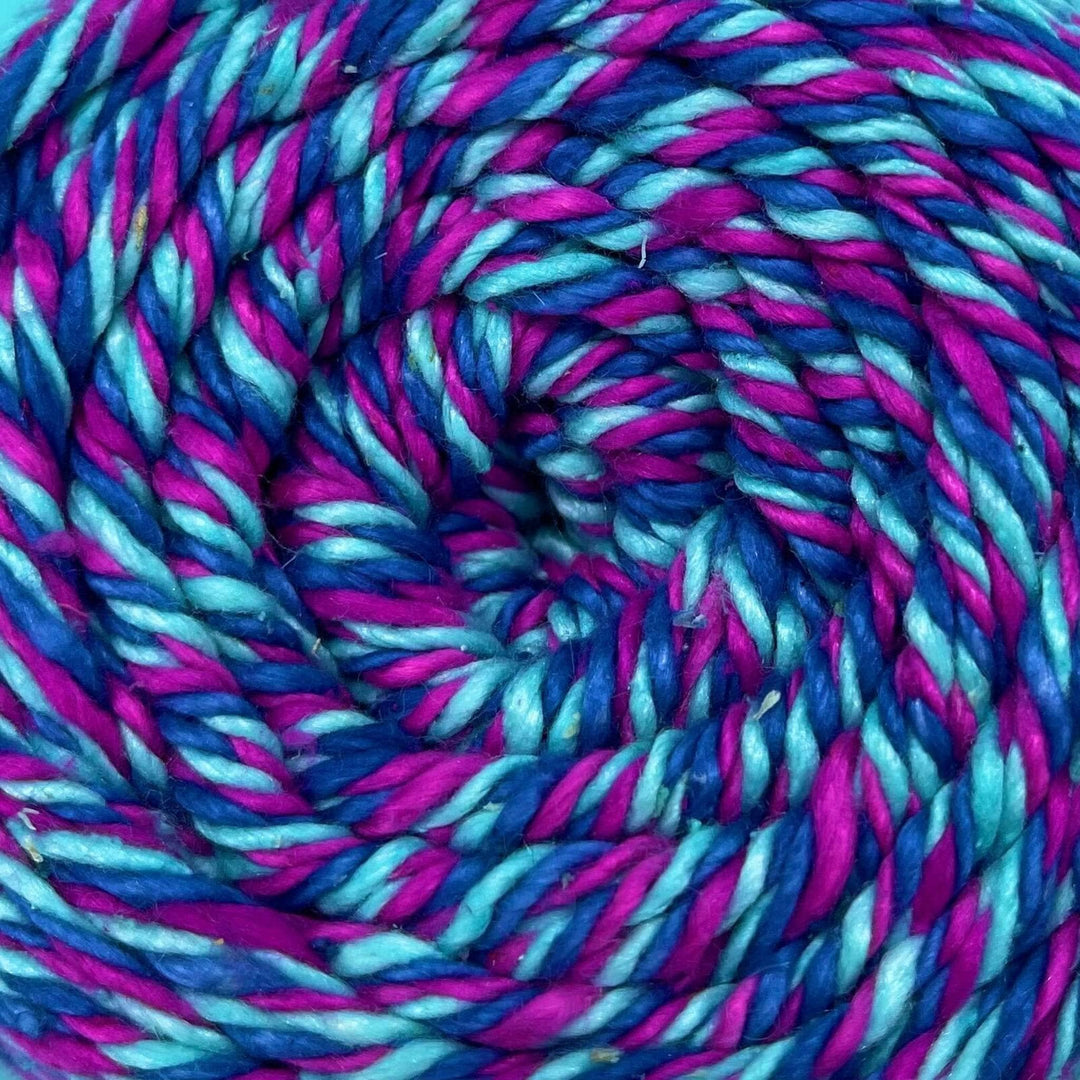 Close up of a triple color twisted weight Yarn.