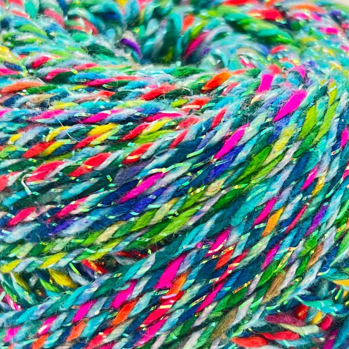 An up close shot of the triple twist DK weight sparkle yarn 'Fairy Lights'