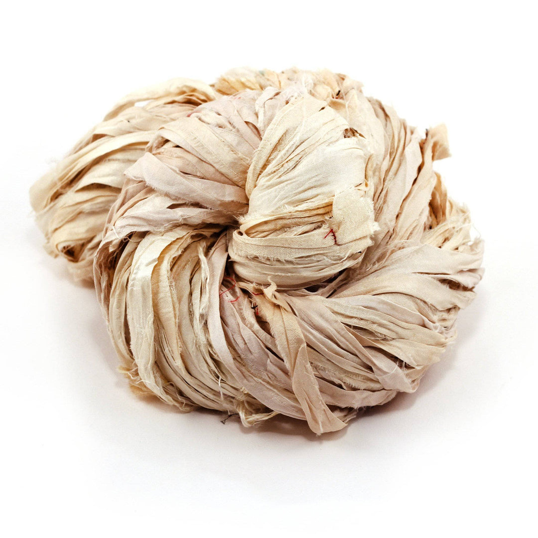 Vintage ivory Sari Silk Ribbon ball on a white background