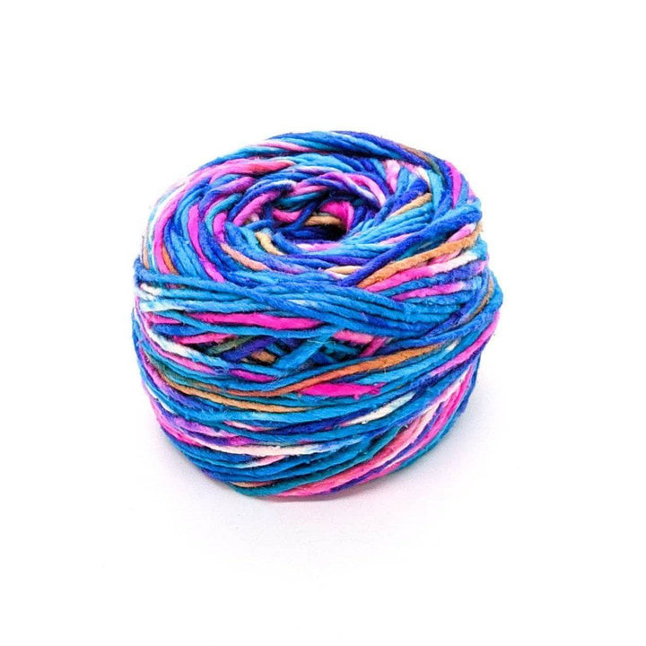 A cake of blue, pink, white, tan, and purple yarn on a white background