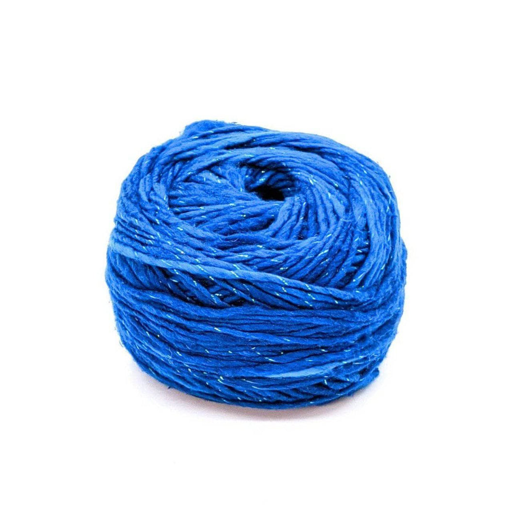A cake of sparkle blue yarn on a white background