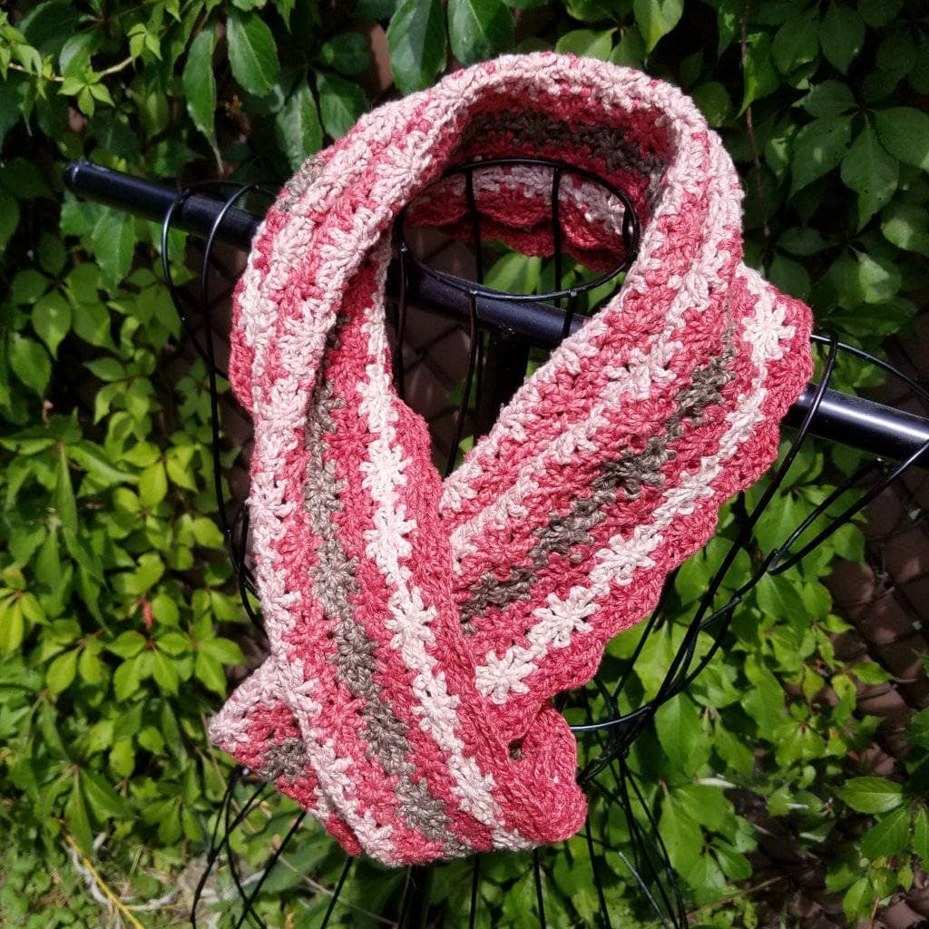 Vintage Rose Infinity Scarf hanging in front of greenery