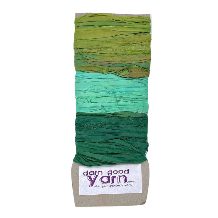 3 shades of green sari silk ribbon yarn on a white background