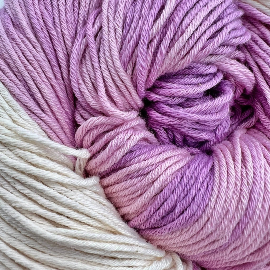 Detailed picture of yarn. Light purple,pink and white yarn on a white background. 100% Organic Pima Cotton DK Weight