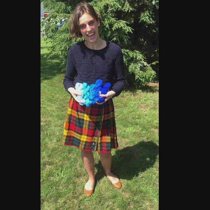 Gif of alyssa showing ombre sport weight silk yarn packs as well as some of the items that can be made from them.