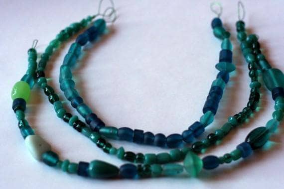 3 of a Kind Rockin' Necklace made of teal beads on a white background
