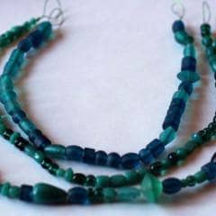 3 of a Kind Rockin' Necklace made of teal beads on a white background