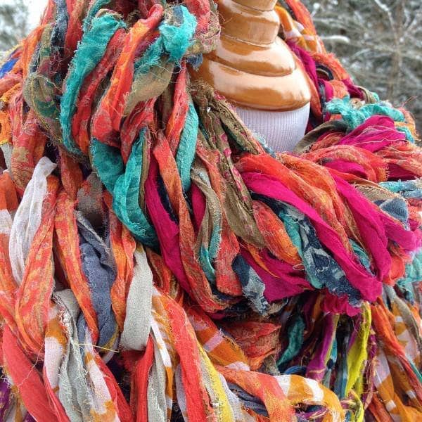 Close up of mannequin wearing 30 Minute Arm Knit Scarf