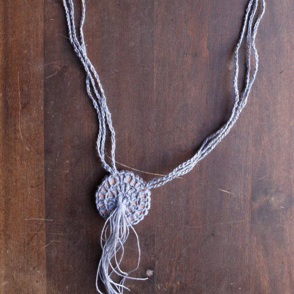 Boho Macrame Necklace in gray on a wooden background