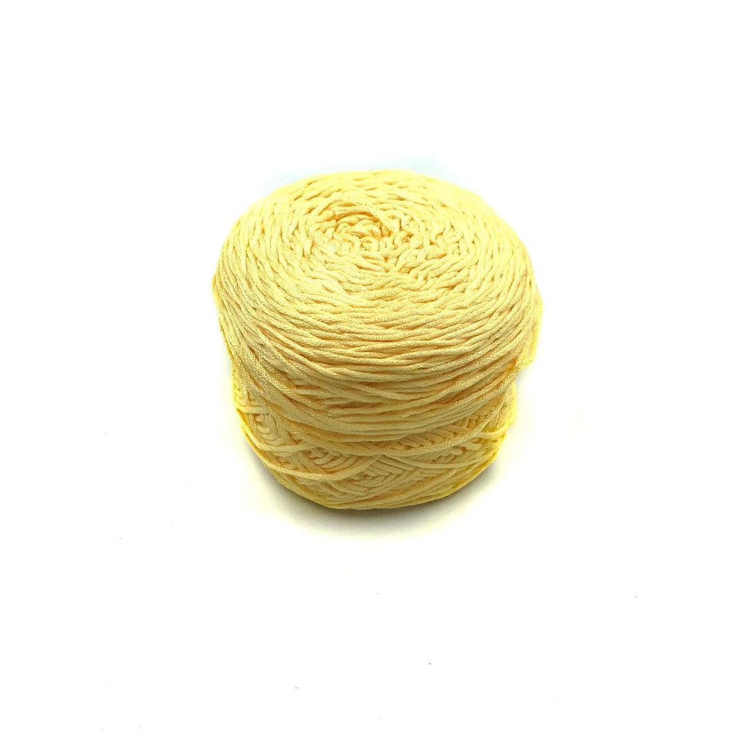 Viscose & Cotton Baby Yarn cake in Daffodil (yellow) on a white background