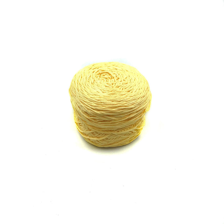 Viscose & Cotton Baby Yarn cake in Daffodil (yellow) on a white background
