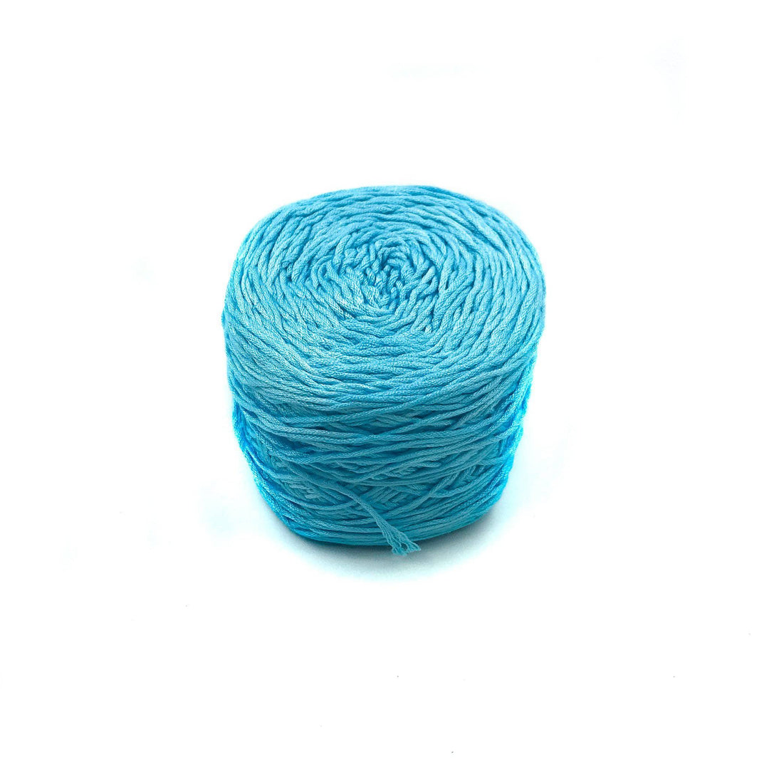 Viscose & Cotton Baby Yarn cake in Hydrangea (blue) on a white background