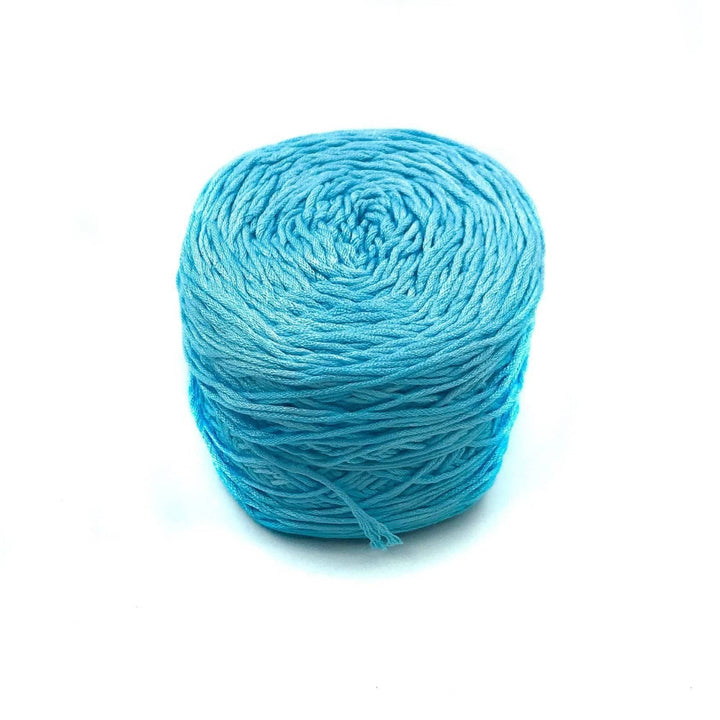 Viscose & Cotton Baby Yarn cake in Hydrangea (blue) on a white background