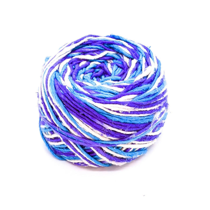 light blue, purple, and white variegated yarn in front of a white background.