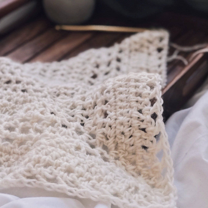 The Calla Cowl Bandana laying on a wooden tray