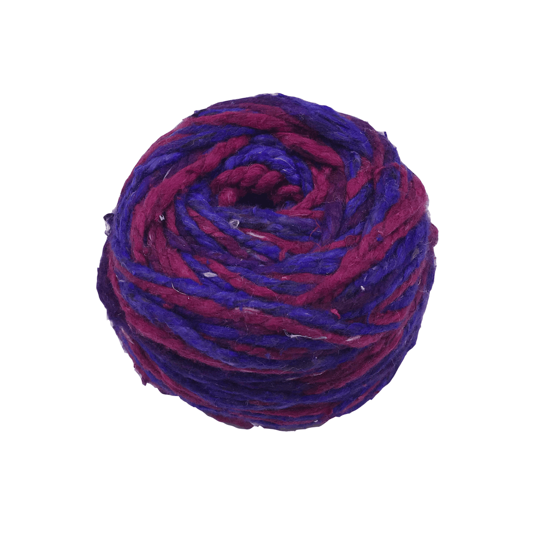 Cake of pink and purple yarn on a white background
