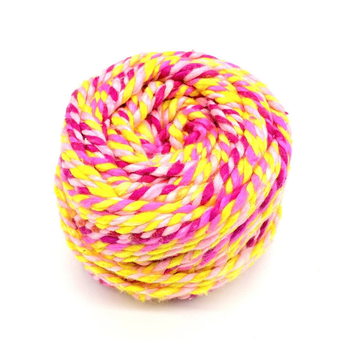 pink and yellow yarn twisted together 