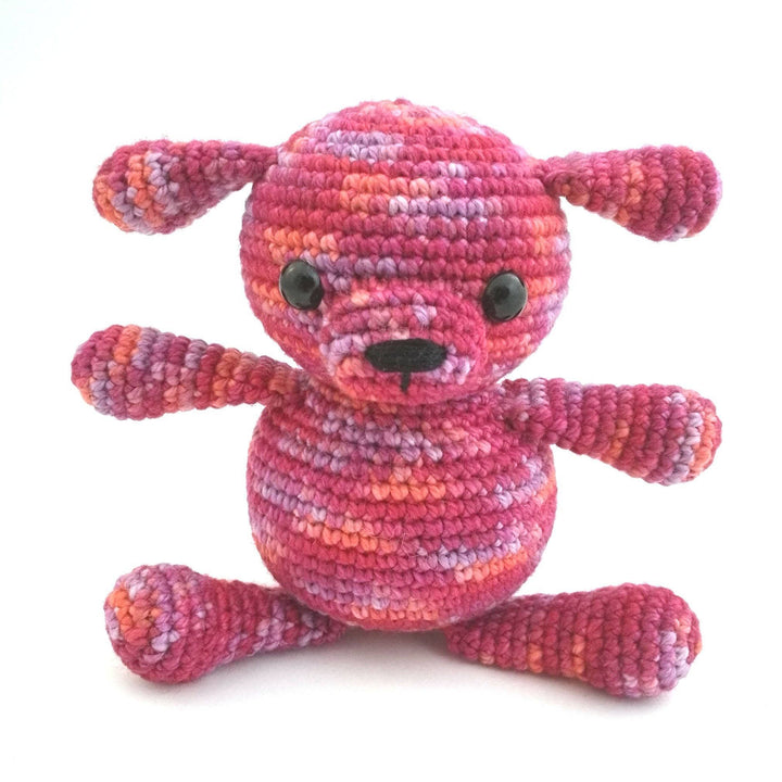 Amigurumi Puppy crocheted in Raspberry (pinks) on a white background