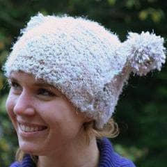 Woman wearing Arctic Snowball Hat in white 