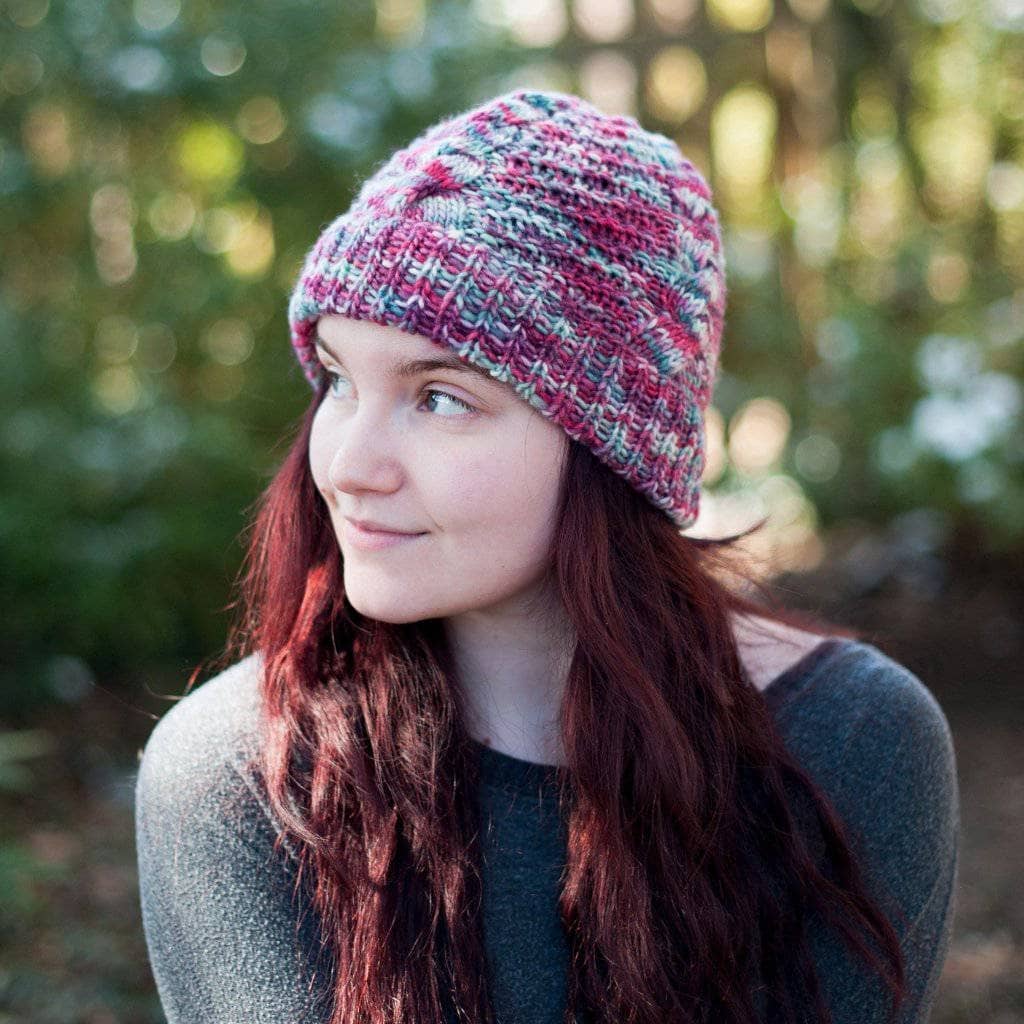 Woman with red hair wearing an Ash Cave Beanie in Benjamin (red and gray)