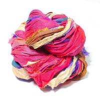 close up birds nest photo of one skein of sari silk ribbon yarn in the at the Bahamas base.