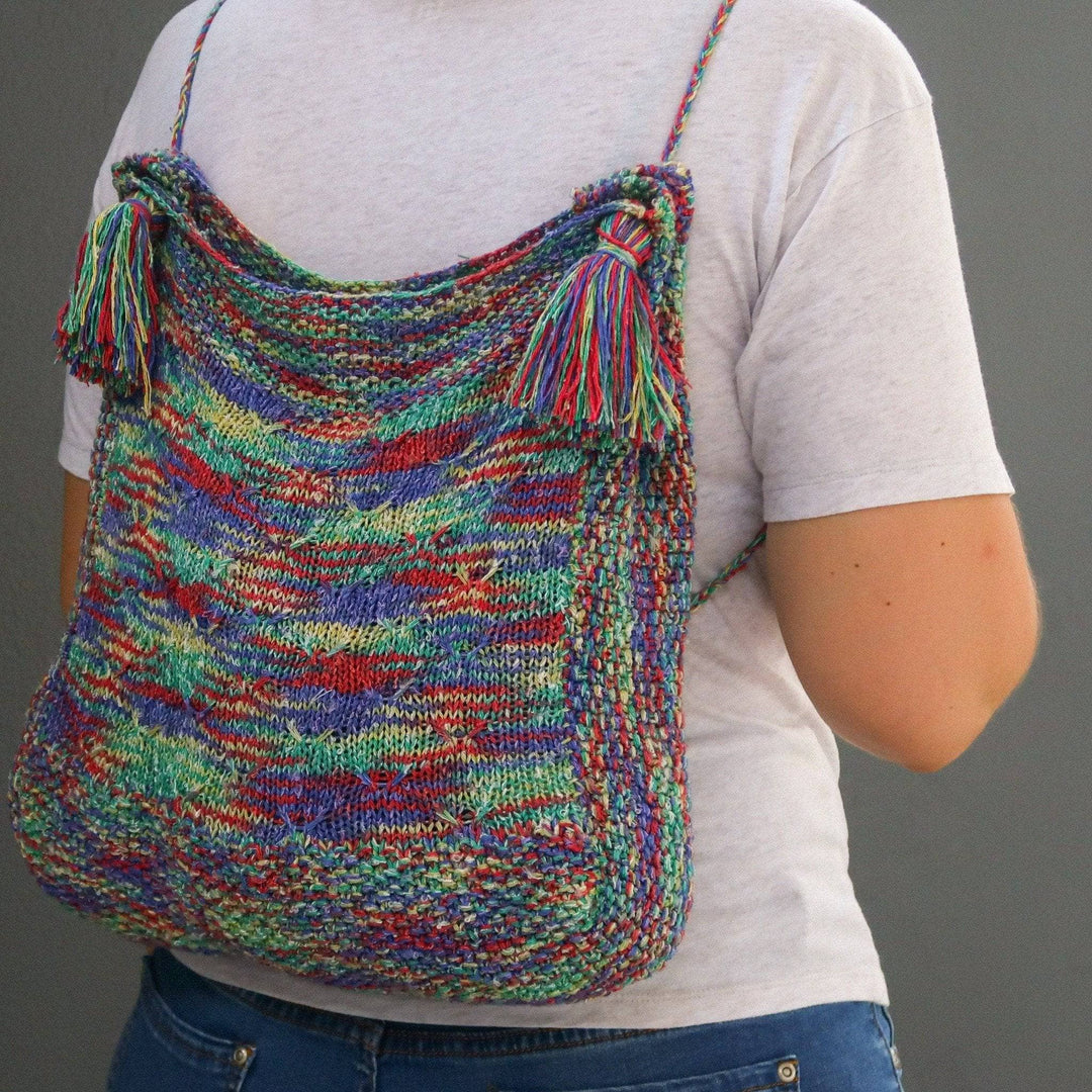 a multicolored bag on a person