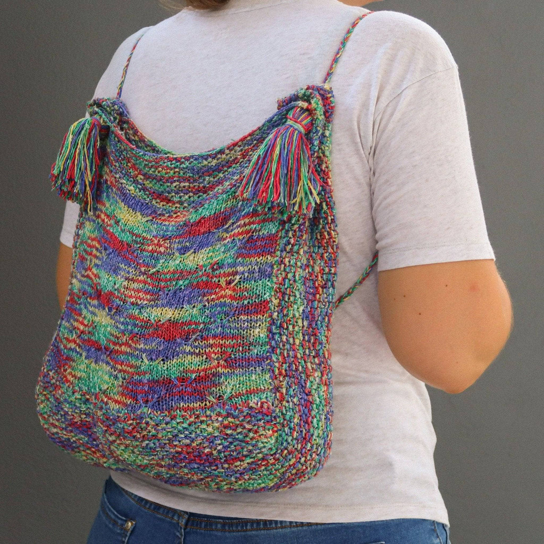 a multicolored bag on a person