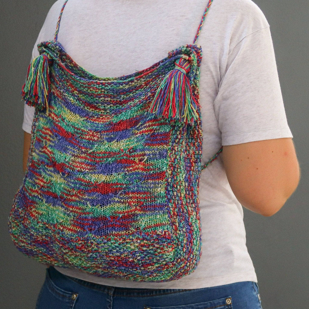 a multicolored bag on a person