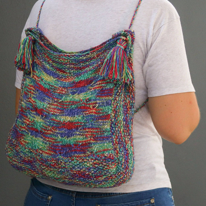 a multicolored bag on a person