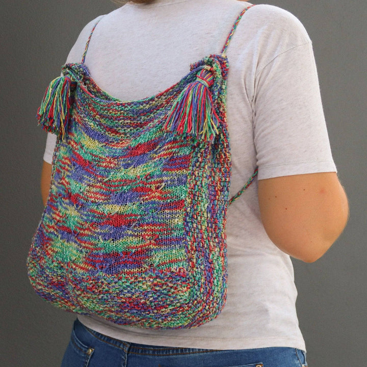a multicolored bag on a person