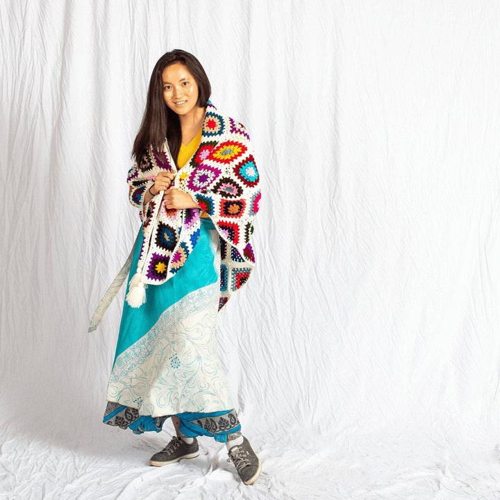 Cape Cod Granny Square Shawl with girl wearing blue skirt