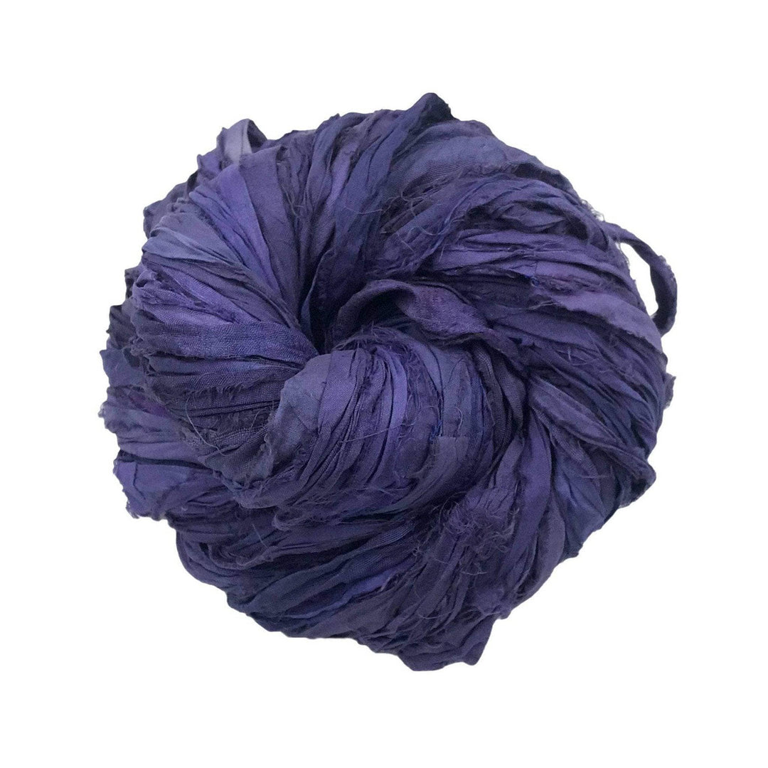 sari silk ribon yarn in the colorway ultra violet in front of a white background.