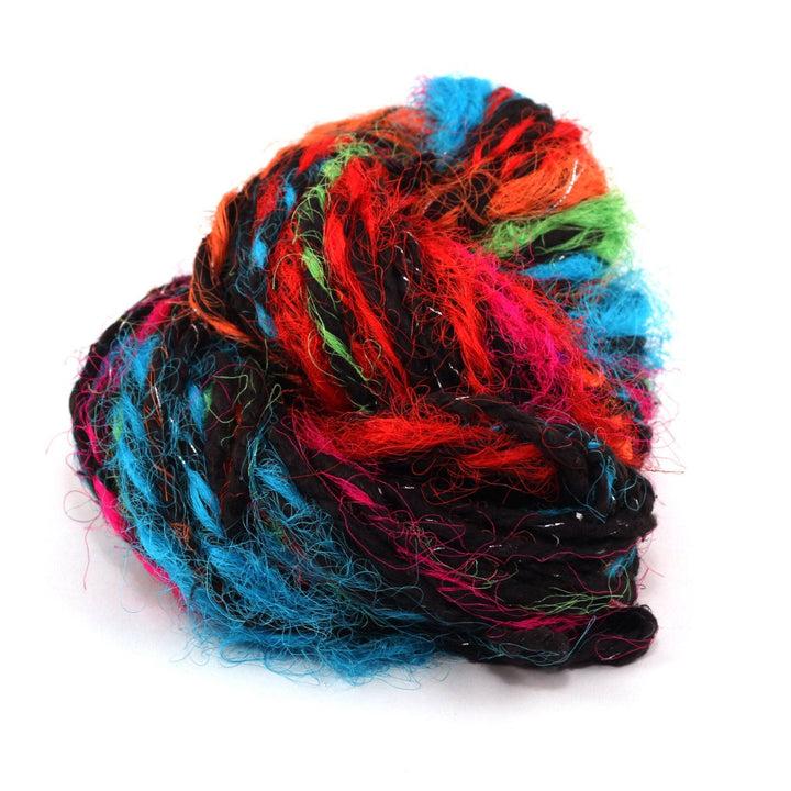Close up image of Darn Good Yarn's Punky Chunky Recycled Silk Yarn in 'Black': A bulky yarn featuring a black base and multicolored silk thrums