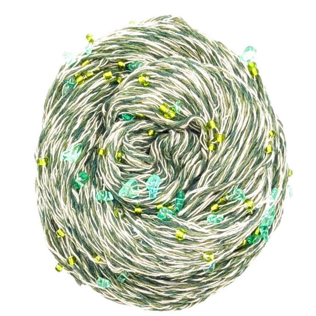 Green and white yarn with green beads and crystals throughout.