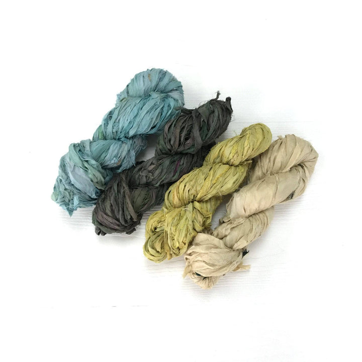 4 skeins of sari silk ribbon in Earth Tone Pack on a white background