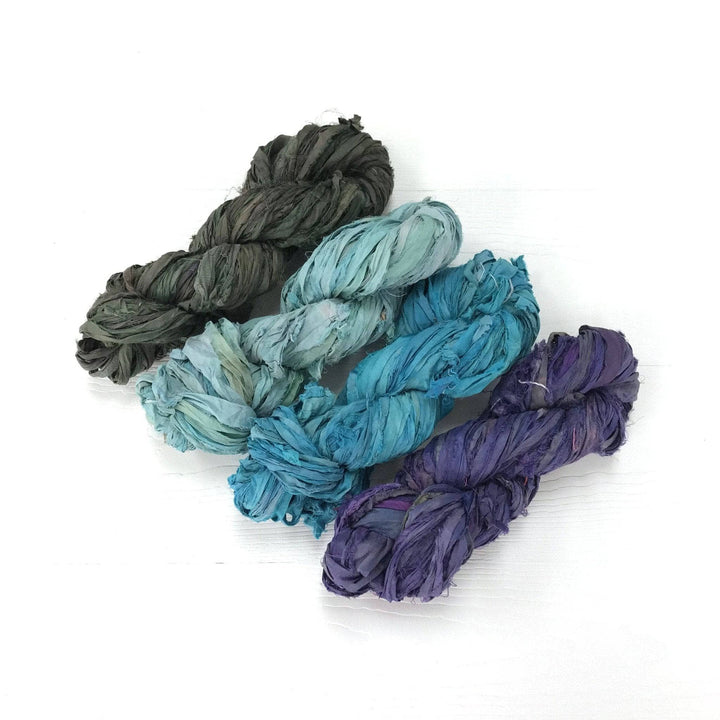 4 skeins of sari silk ribbon in Jewel Tone Pack on a white background