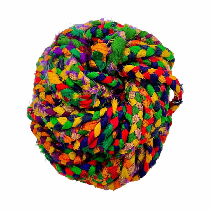 close up image of sari silk ribbon yarn in retro rainbow colorway.