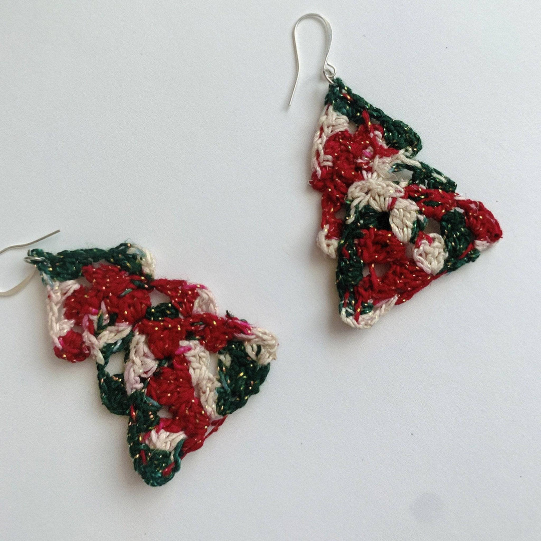 green, white and red sparkle Christmas tree yarn earrings on a white background