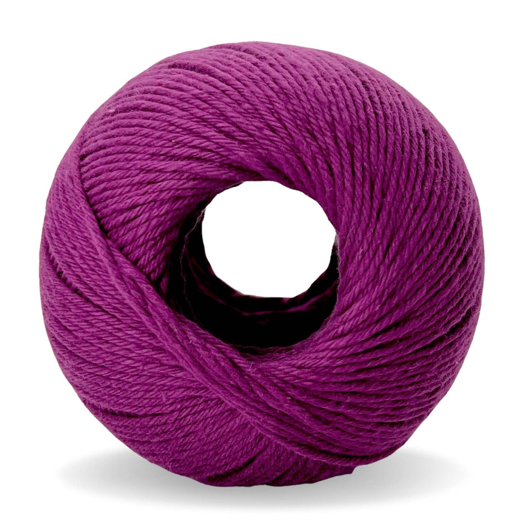 Skein of Purple cotton yarn in front of a white background.