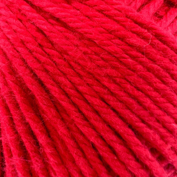 close up image of raspberry red cotton yarn to show detail.