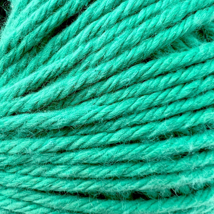 Closeup image of teal circulo maxcolor yarn in teal to show yarn detail.